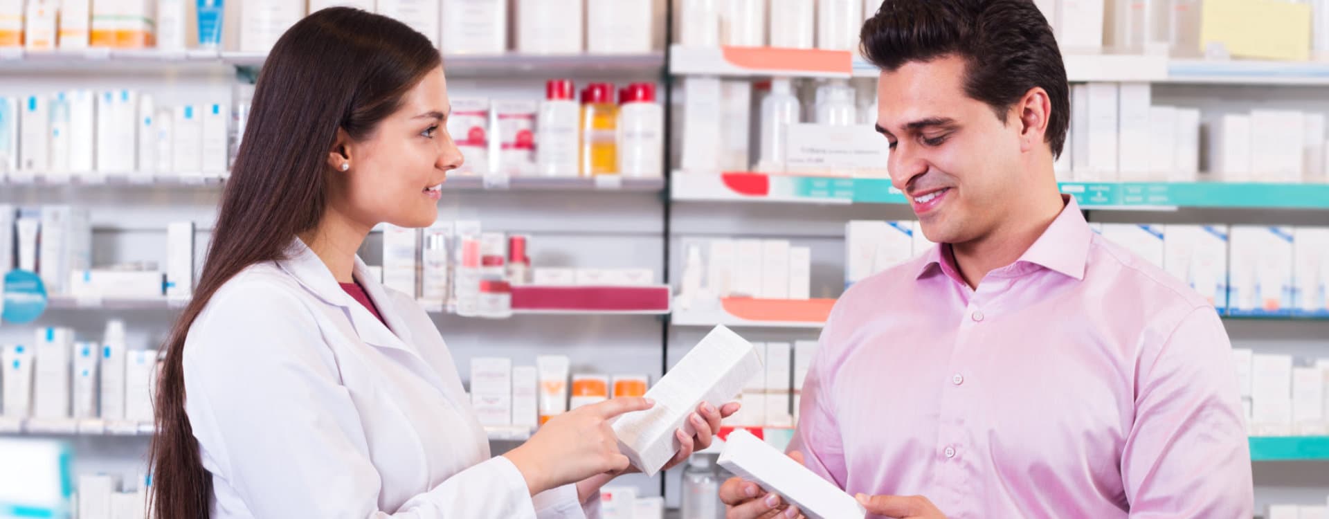 pharmacist and customer reading label